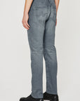 model wearing ag jeans tellis modern slim jean in 17 years gibson grey, showing the rear