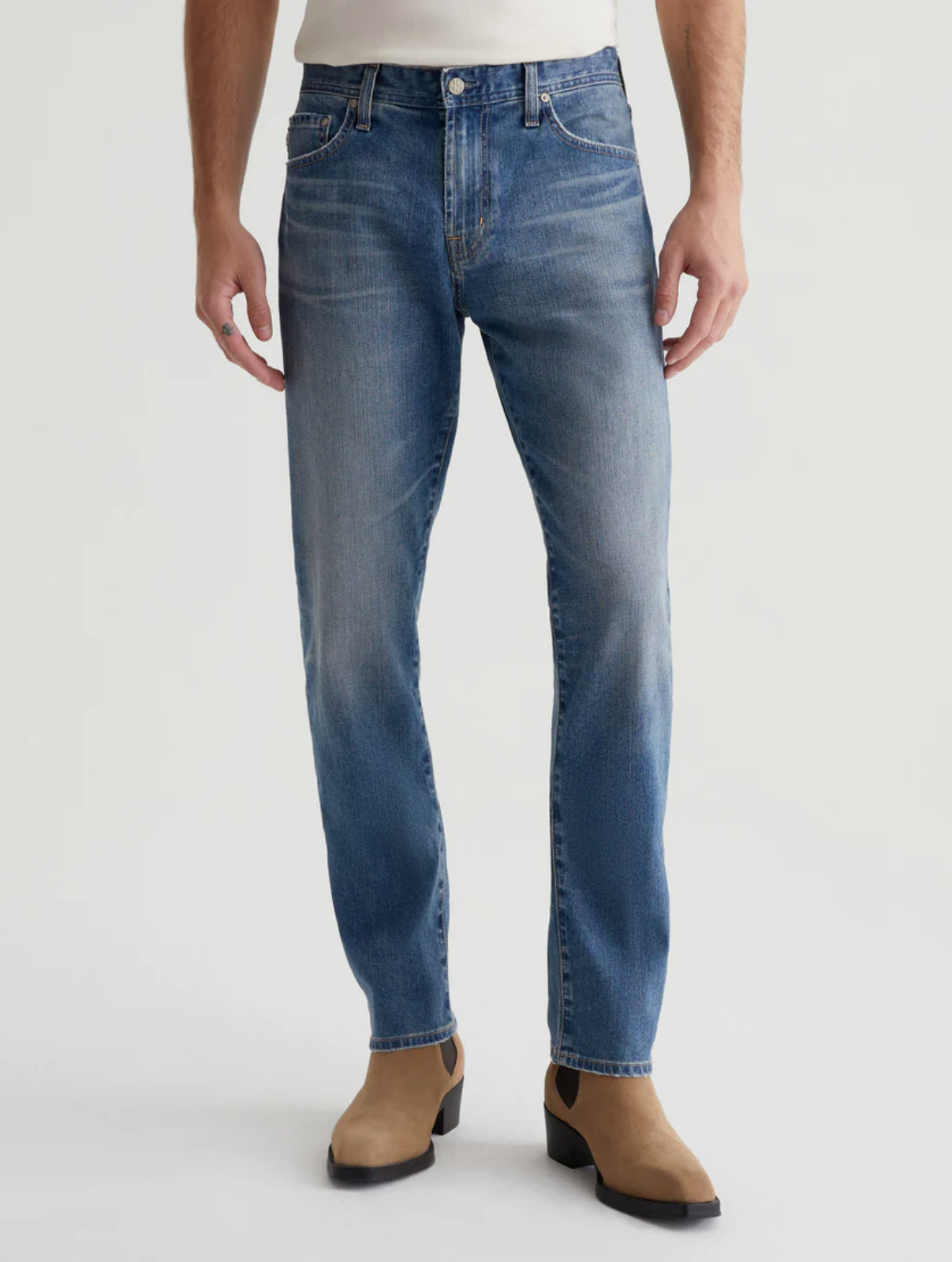 model wearing ag jeans tells modern slim jean in 16 years clifton blue, shown from the waist down