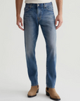 model wearing ag jeans tells modern slim jean in 16 years clifton blue, shown from the waist down