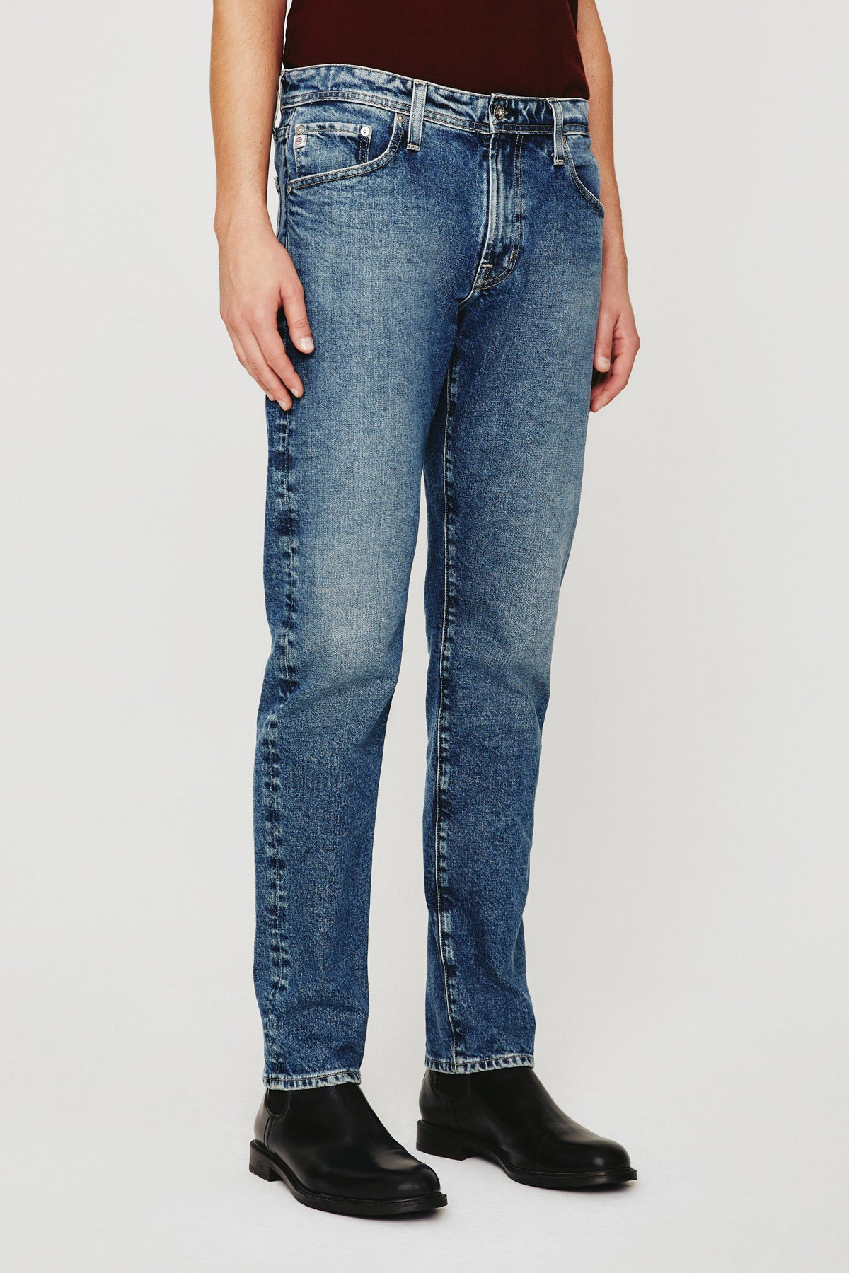 model wearing ag jeans tellis modern slim jean in warhol blue, shown from the waist down
