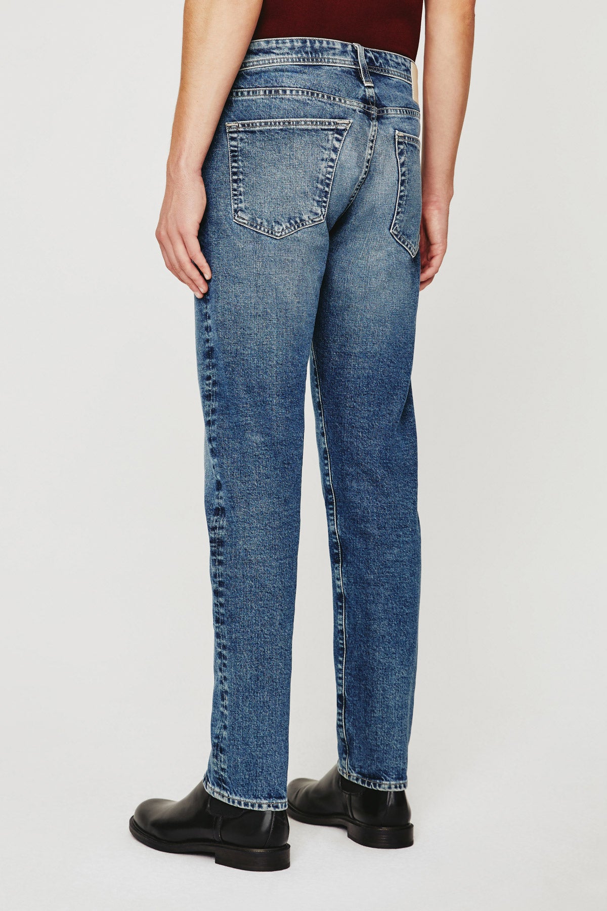 model wearing ag jeans tellis modern slim jean in warhol blue, shown from the waist down