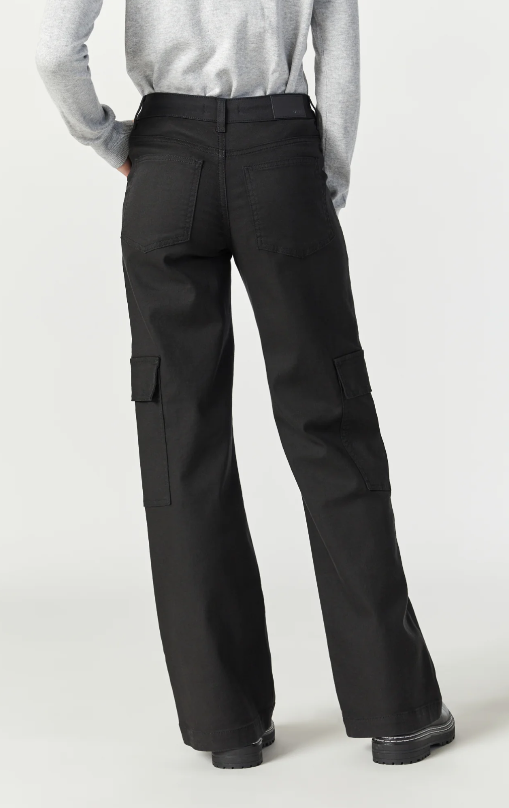 model wearing mavi jeans alva cargo pant in black luxe twill, from the back