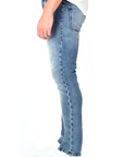 model wearing fidelity denim torino slim fit jean in bataclan blue, shown from the side