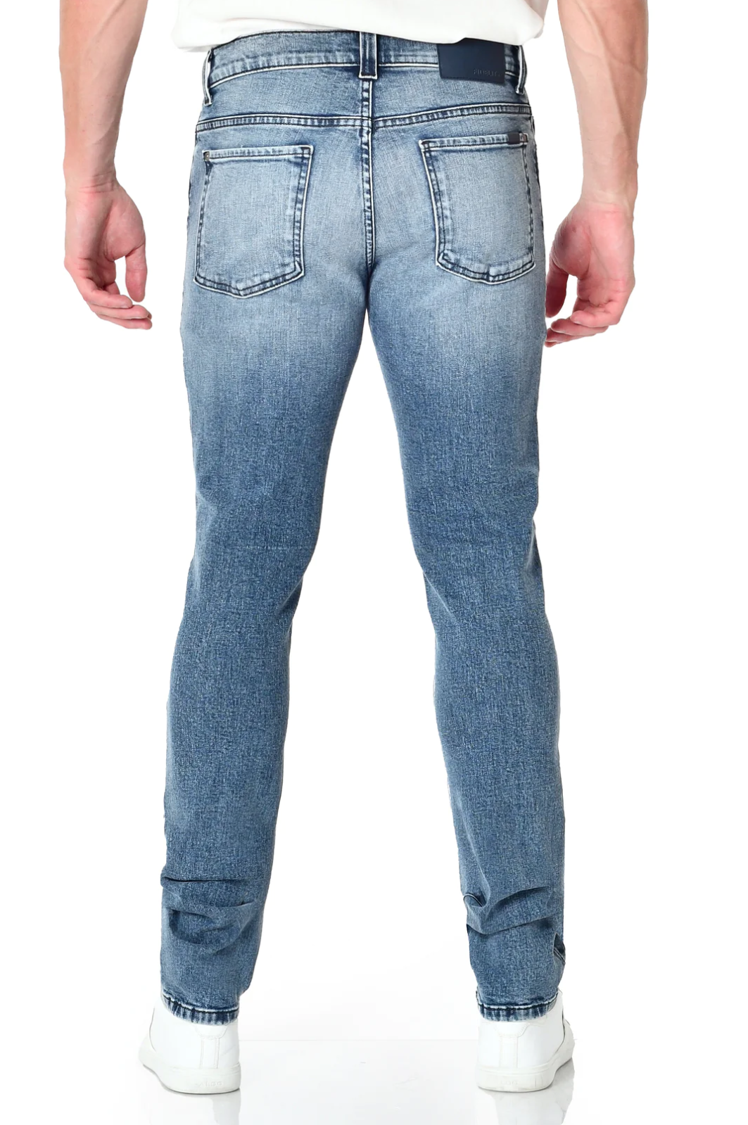 model wearing fidelity denim torino slim fit jean in bataclan blue, shown from the rear