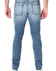 model wearing fidelity denim torino slim fit jean in bataclan blue, shown from the rear