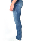 model wearing fidelity denim torino slim fit jean in tower blue, shown from the side