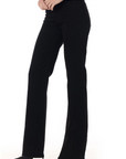 model wearing fidelity denim katie trouser fit in jett black, shown from the side