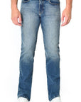 model wearing fidelity denim jimmy slim straight jean in el ray blue, shown from the waist down