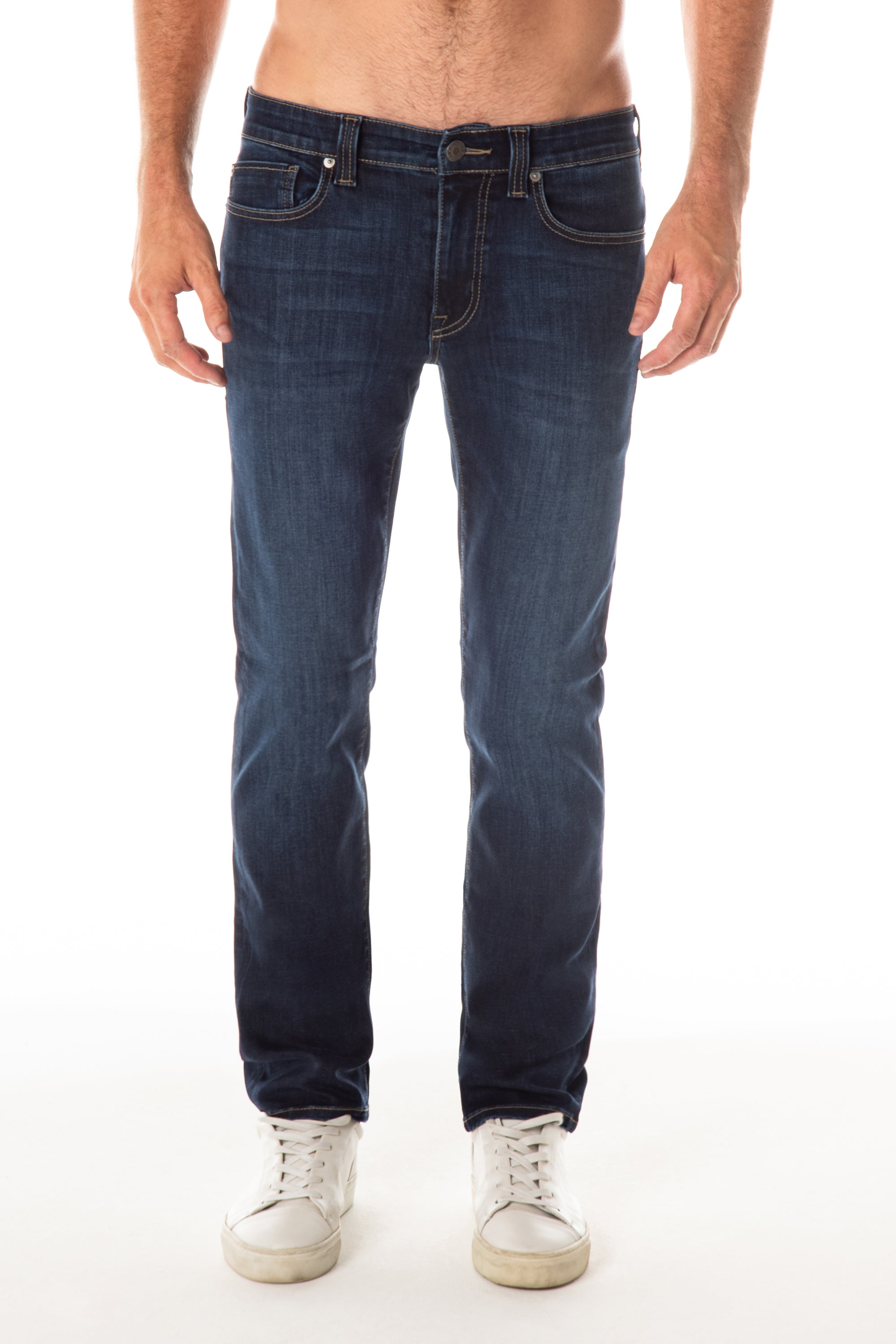 model wearing fidelity denim jimmy slim straight jean in empirical blue, shown from the waist down