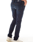 model wearing fidelity denim jimmy slim straight jean in empirical blue, shown from the rear