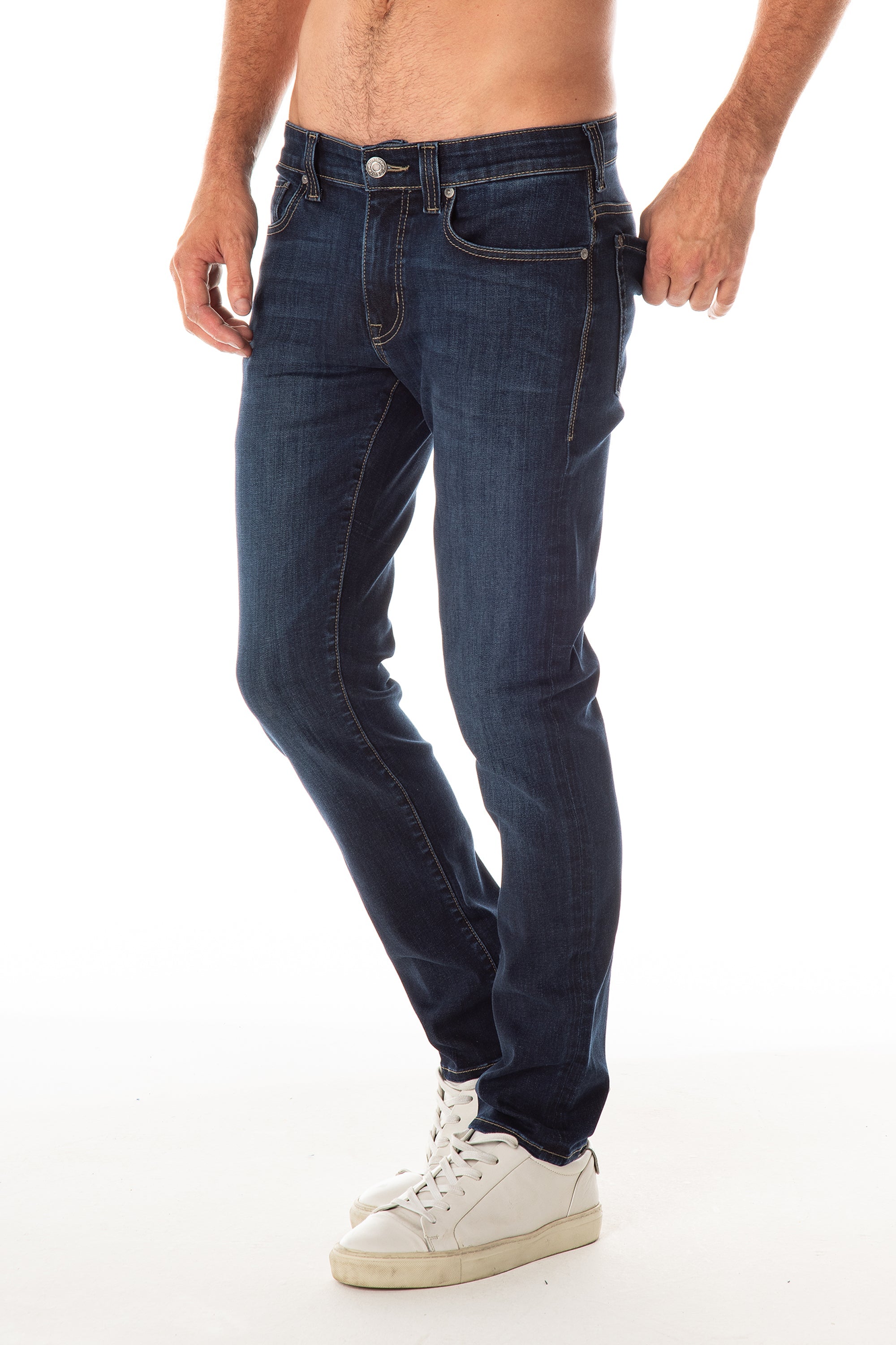 model wearing fidelity denim jimmy slim straight jean in empirical blue, shown from the side