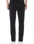 model wearing fidelity denim torino slim fit jean in gotham black, shown from the rear
