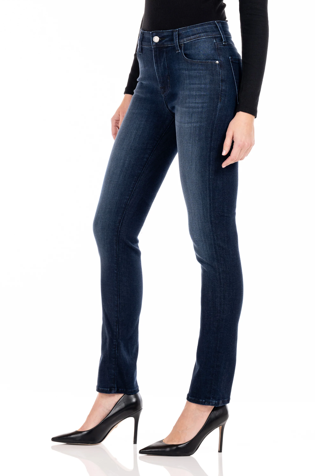 model wearing fidelity denim stevie mid rise slim jean in richmond blue, shown from the side