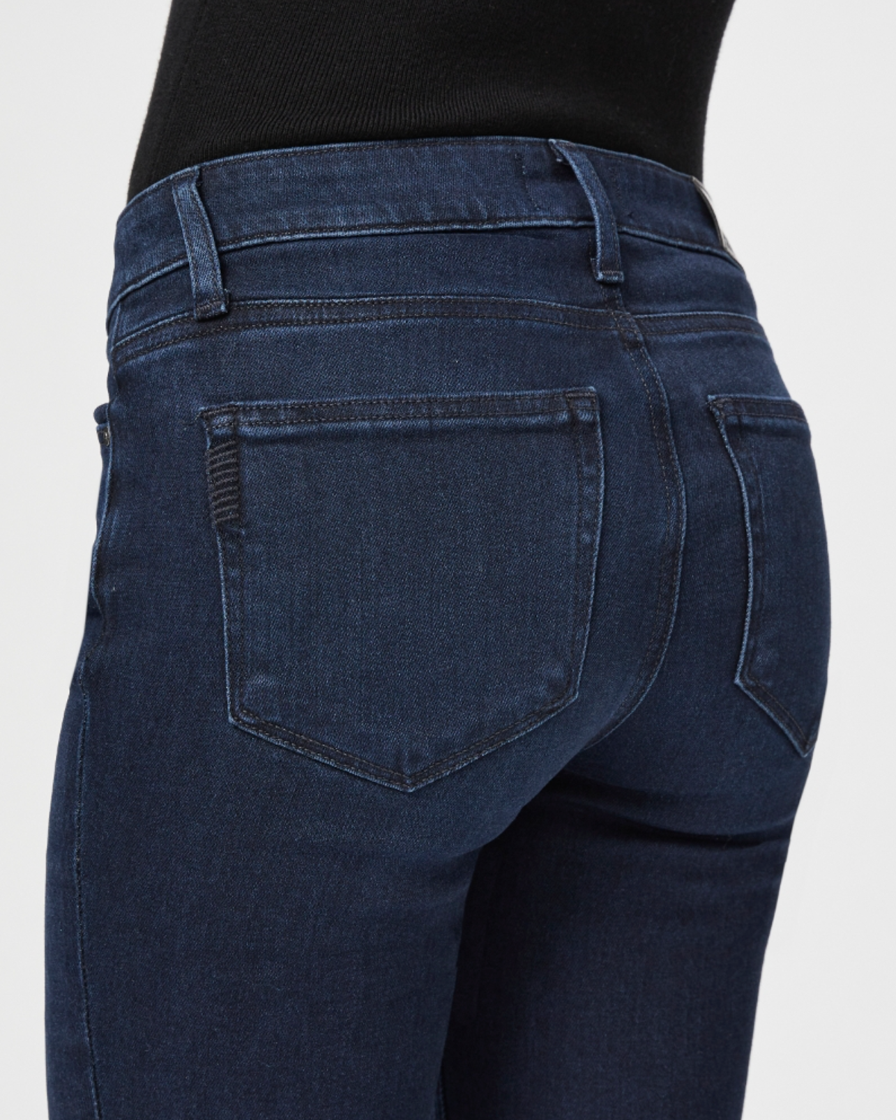 close up rear view of the skyline mid rise straight jean from paige in manifesto dark blue, showing rear pocket detail