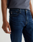 close up of the front of ag jeans dylan slim fit jean in midlands blue, showing front pocket detail