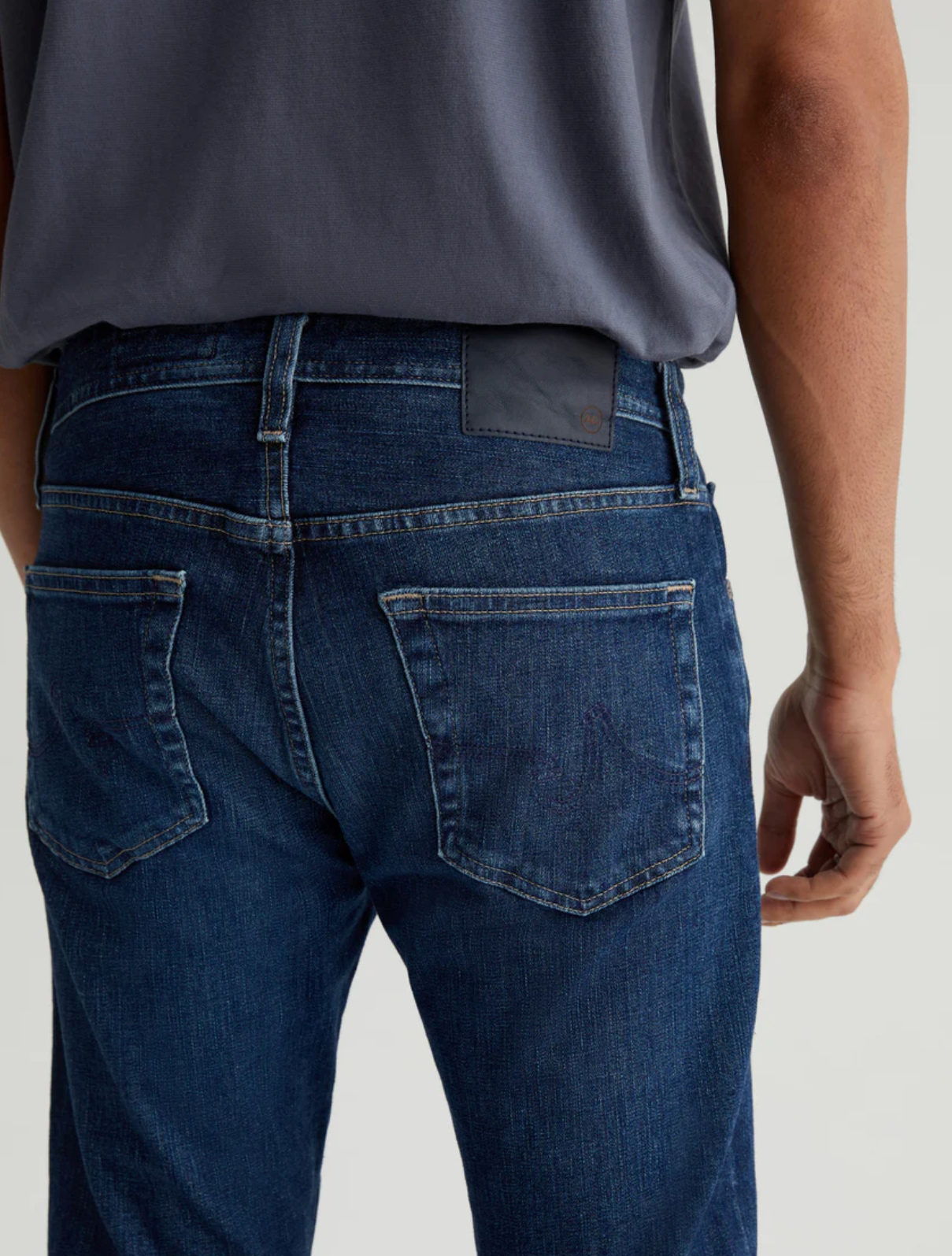 close up of the rear of ag jeans dylan slim fit jean in midlands blue, showing rear pocket detail