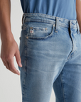 close up of the front of the ag jeans kora high rise wide leg jean in recall blue, showing front pockets