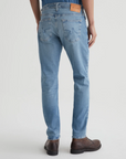 model wearing ag jeans dylan slim fit jean in 16 years el ray blue shown from the rear