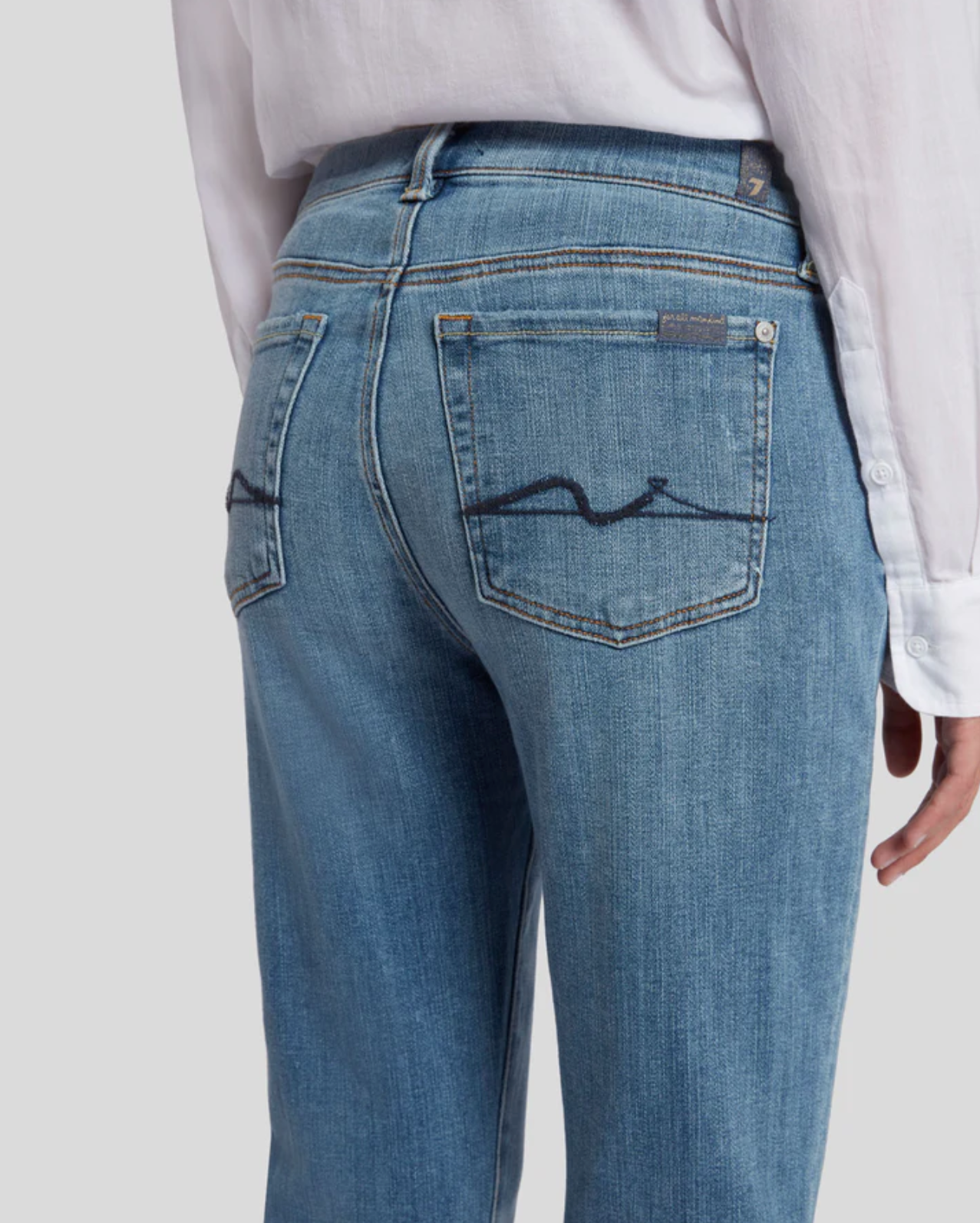 close up the rear of 7 for all mankind josefina boyfriend fit jean in bright light broken twill blue, showing back pocket details