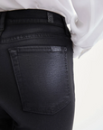 rear pocket close up view of 7 for all mankind's high waist slim kick coated pant in black 