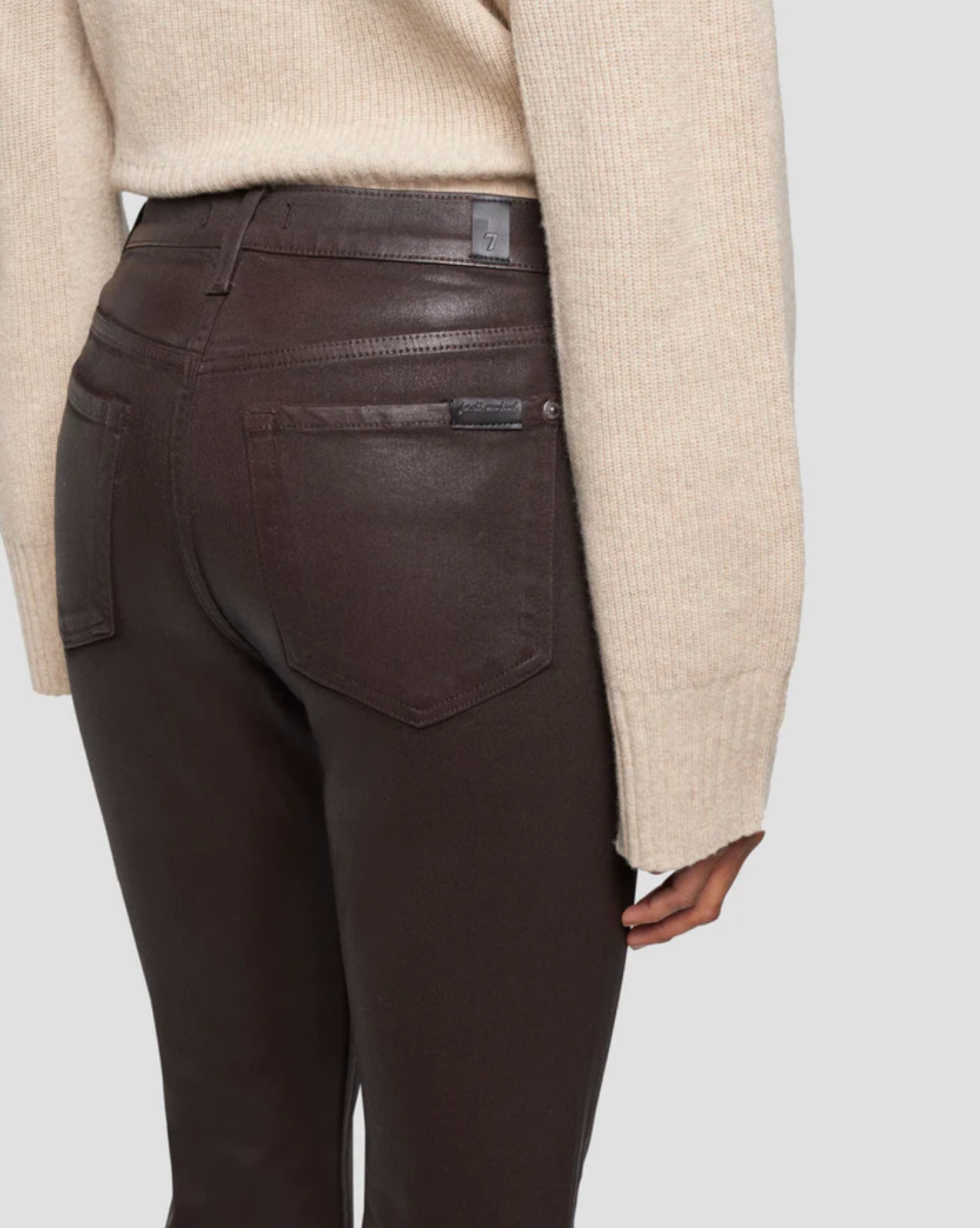 rear pocket close up view of 7 for all mankind&#39;s high waist slim kick coated pant in chocolate brown