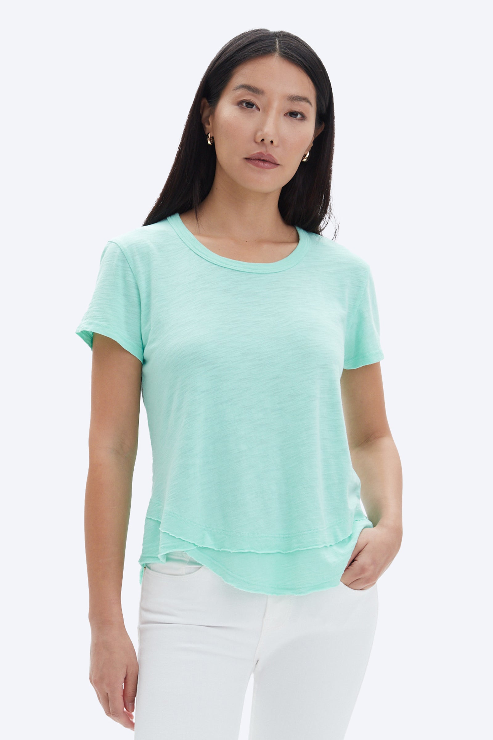 model wearing chrldr ava mock layer t shirt in light green