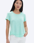 model wearing chrldr ava mock layer t shirt in light green