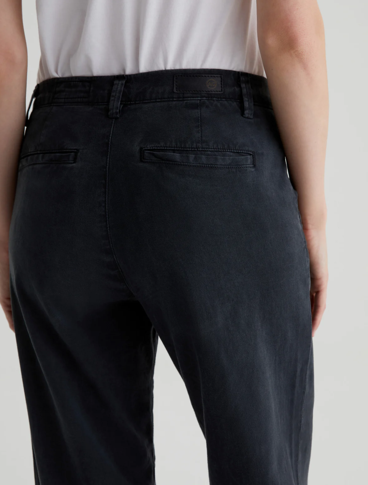 up close view of the waistline with model facing away to show the rear