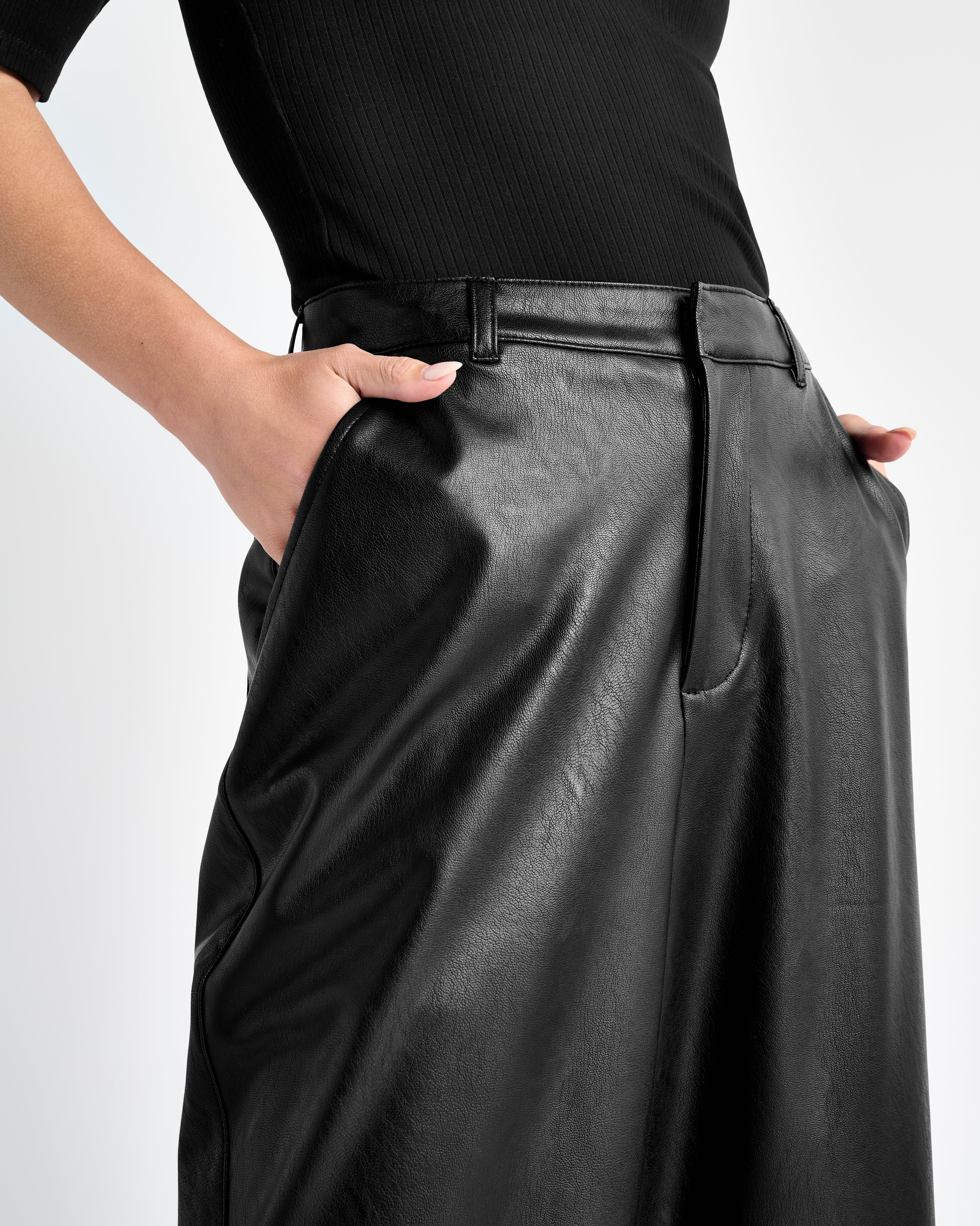 close up view of the waistline of the vegan leather ankle length wide leg trousers