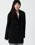 model wearing genie knit boyfriend blazer in black, front view