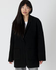 model wearing genie knit boyfriend blazer in black, buttoned