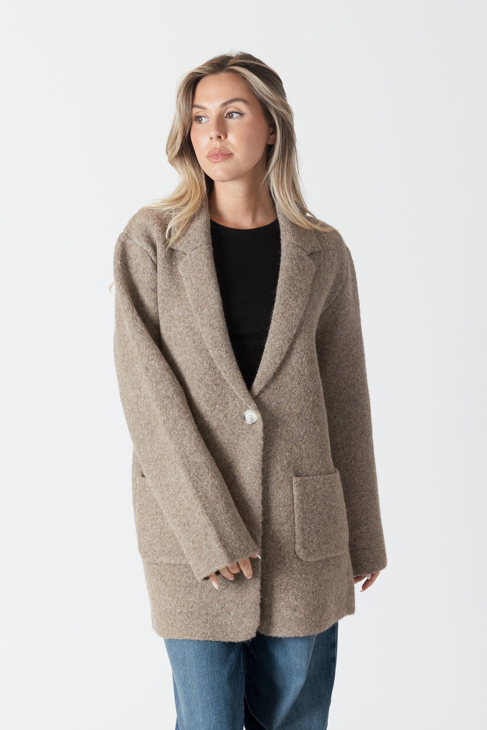 model wearing genie knit boyfriend blazer in beige, front view