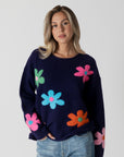 model wearing lyla & luxe jodi multicolour flower print sweater, front view