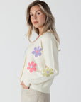 model wearing jolene button front floral print cardi from lyla & luxe, side view 