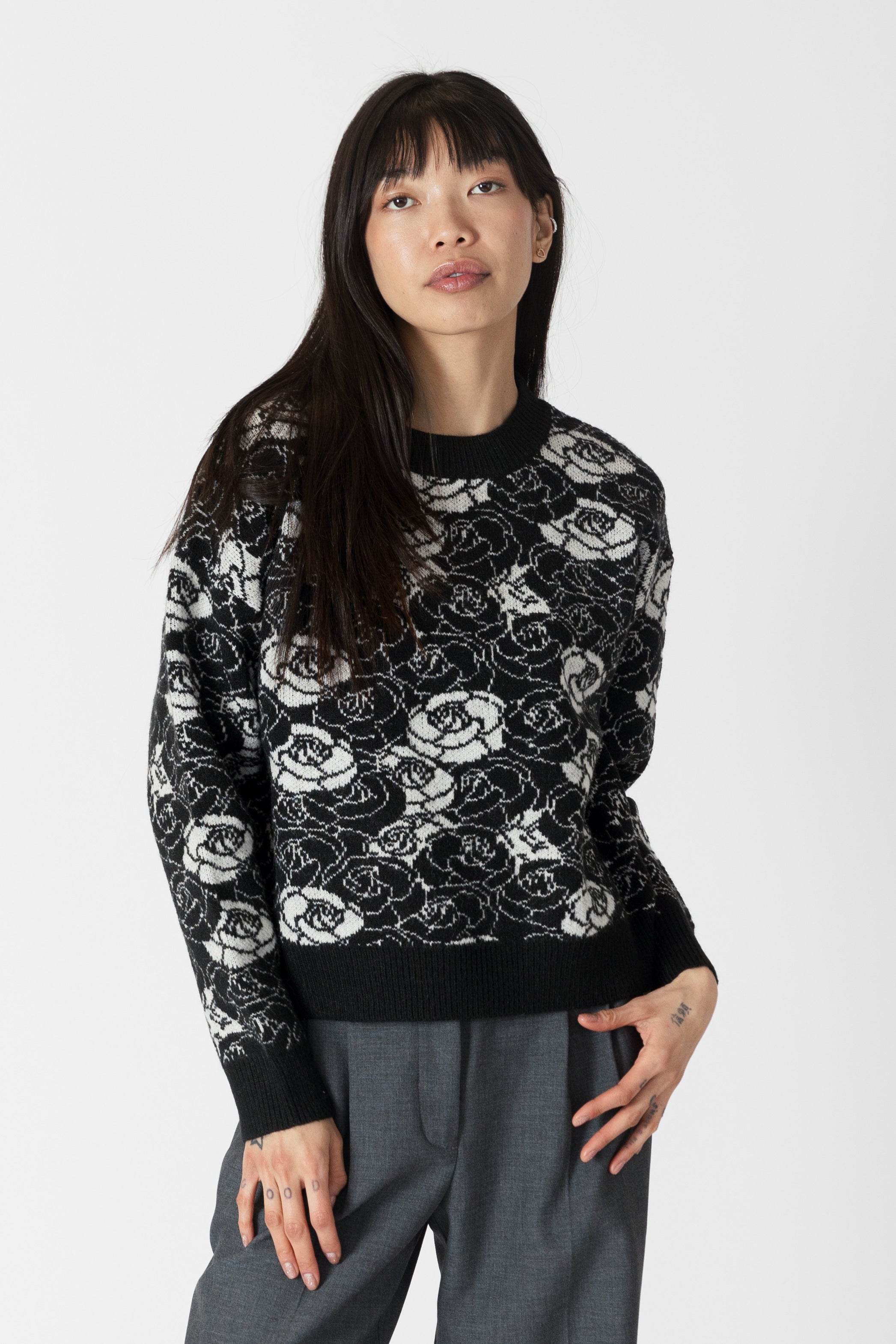 model wearing jordyn rose print crew neck sweater from lyla &amp; luxe, front view