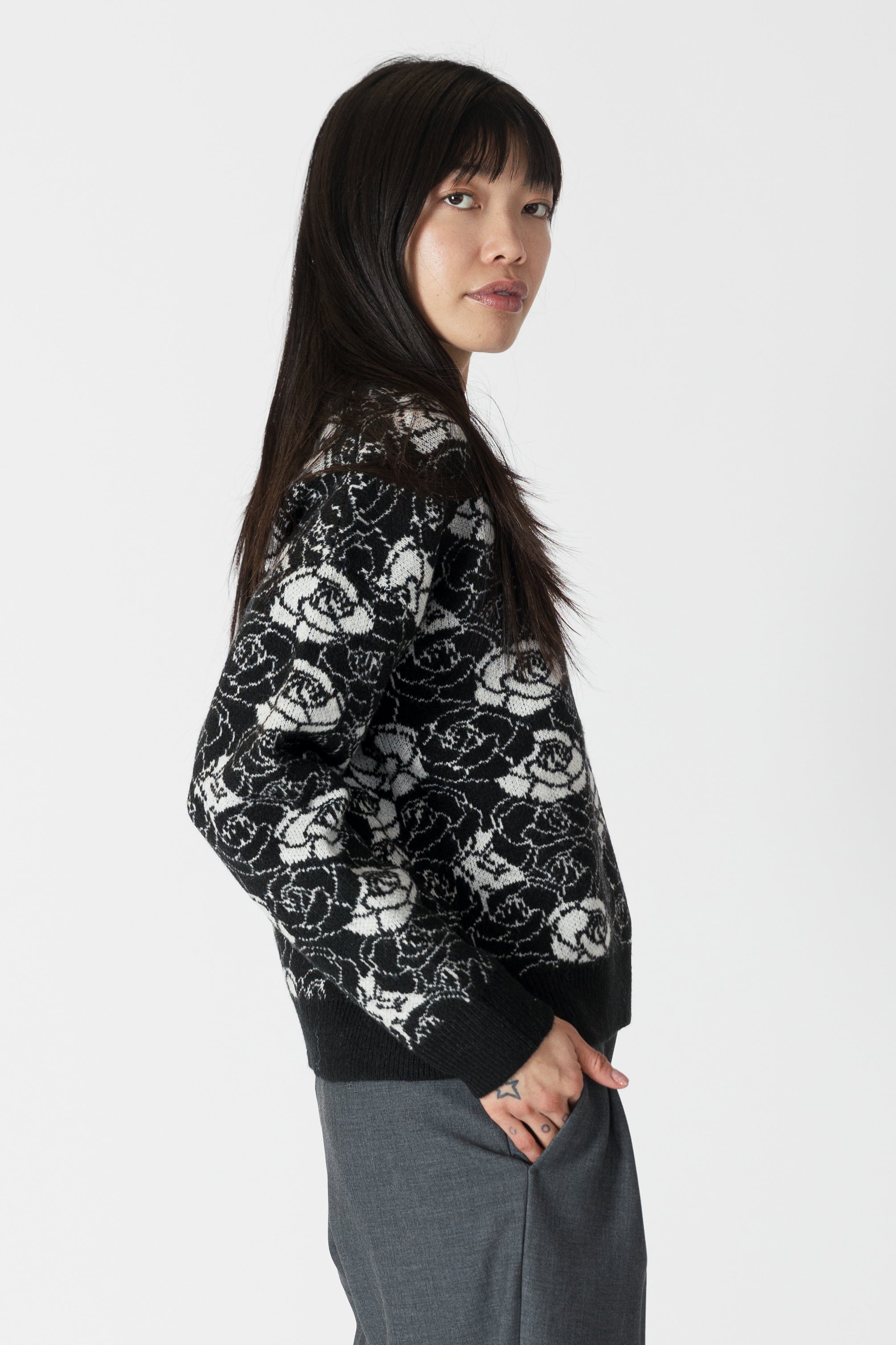 model wearing jordyn rose print crew neck sweater from lyla &amp; luxe, side view