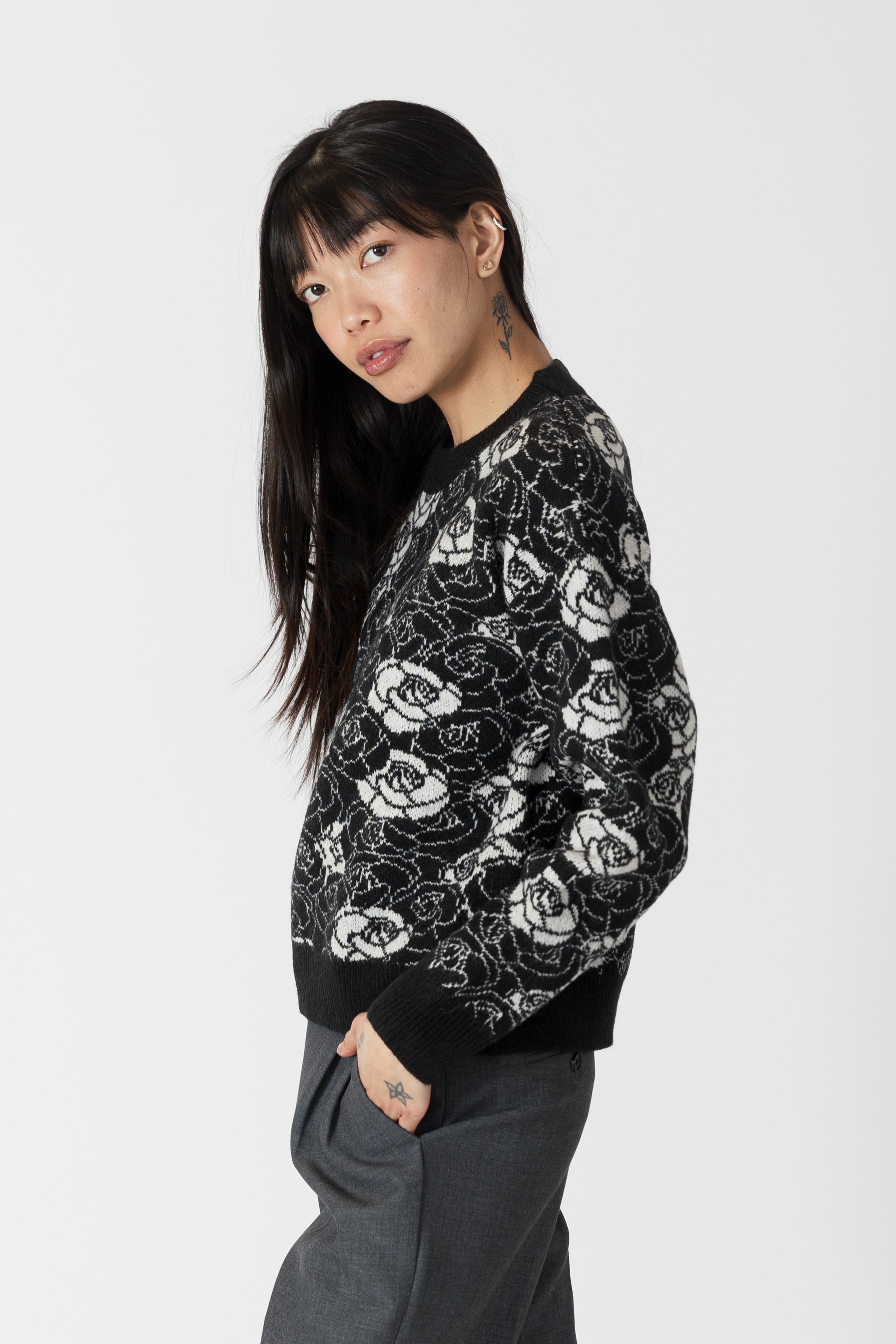 model wearing jordyn rose print crew neck sweater from lyla &amp; luxe, side view