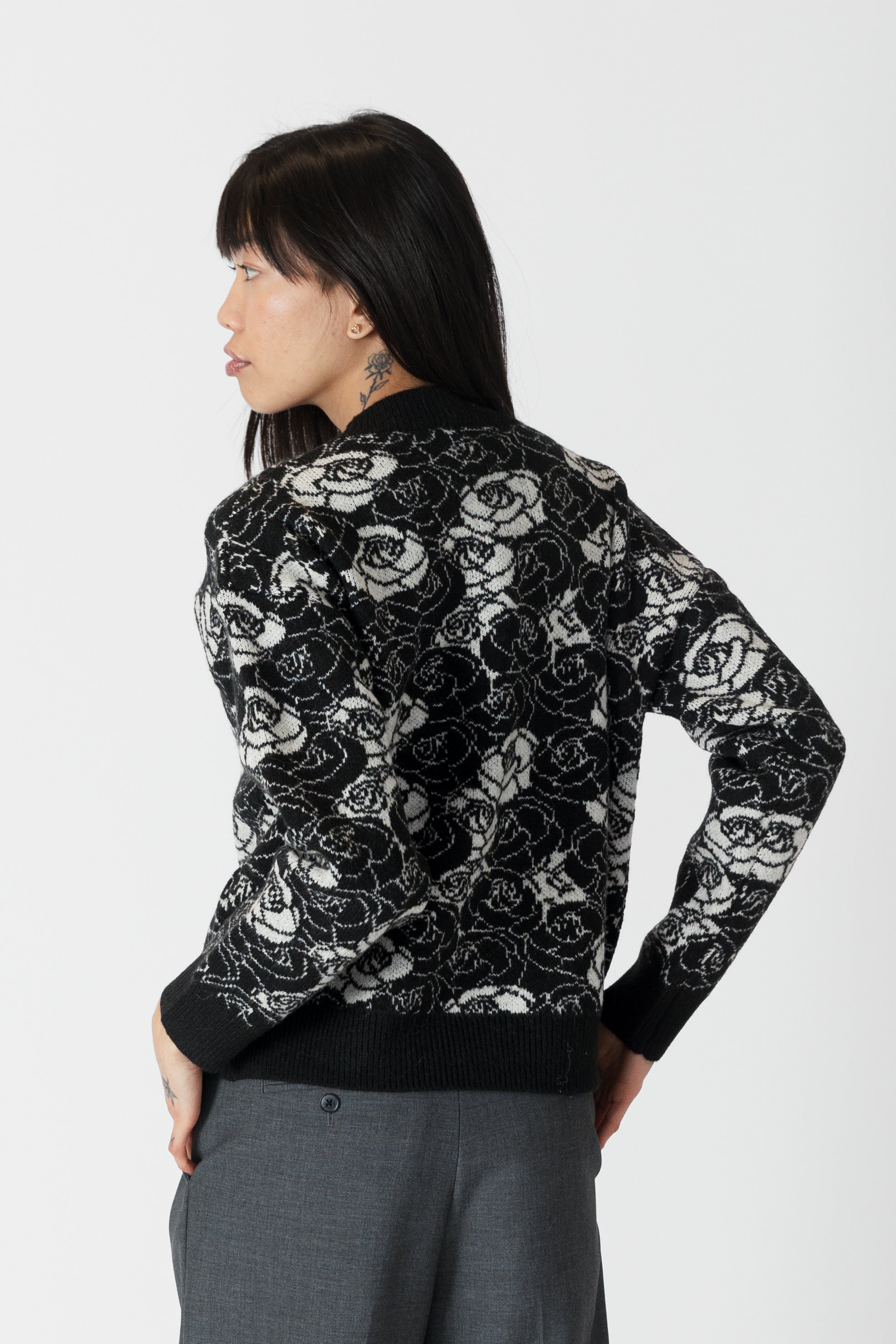 model wearing jordyn rose print crew neck sweater from lyla &amp; luxe, rear view