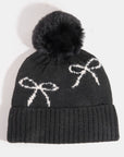 BOW PRINT TOQUE WITH FAUX FUR POMPOM