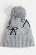BOW PRINT TOQUE WITH FAUX FUR POMPOM