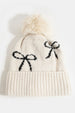 BOW PRINT TOQUE WITH FAUX FUR POMPOM