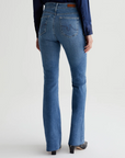 model wearing ag jeans farrah boot cut jean in montecito blue, shown from the rear