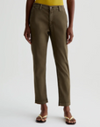 model wearing caden tailored trouser in sulfur shady moss green, shown from the waist down