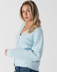 model wearring lyla & luxe stella crystal button cardigan, side view