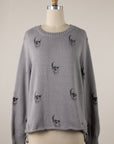 SHADOW SKULL ROLL HEM SWEATER