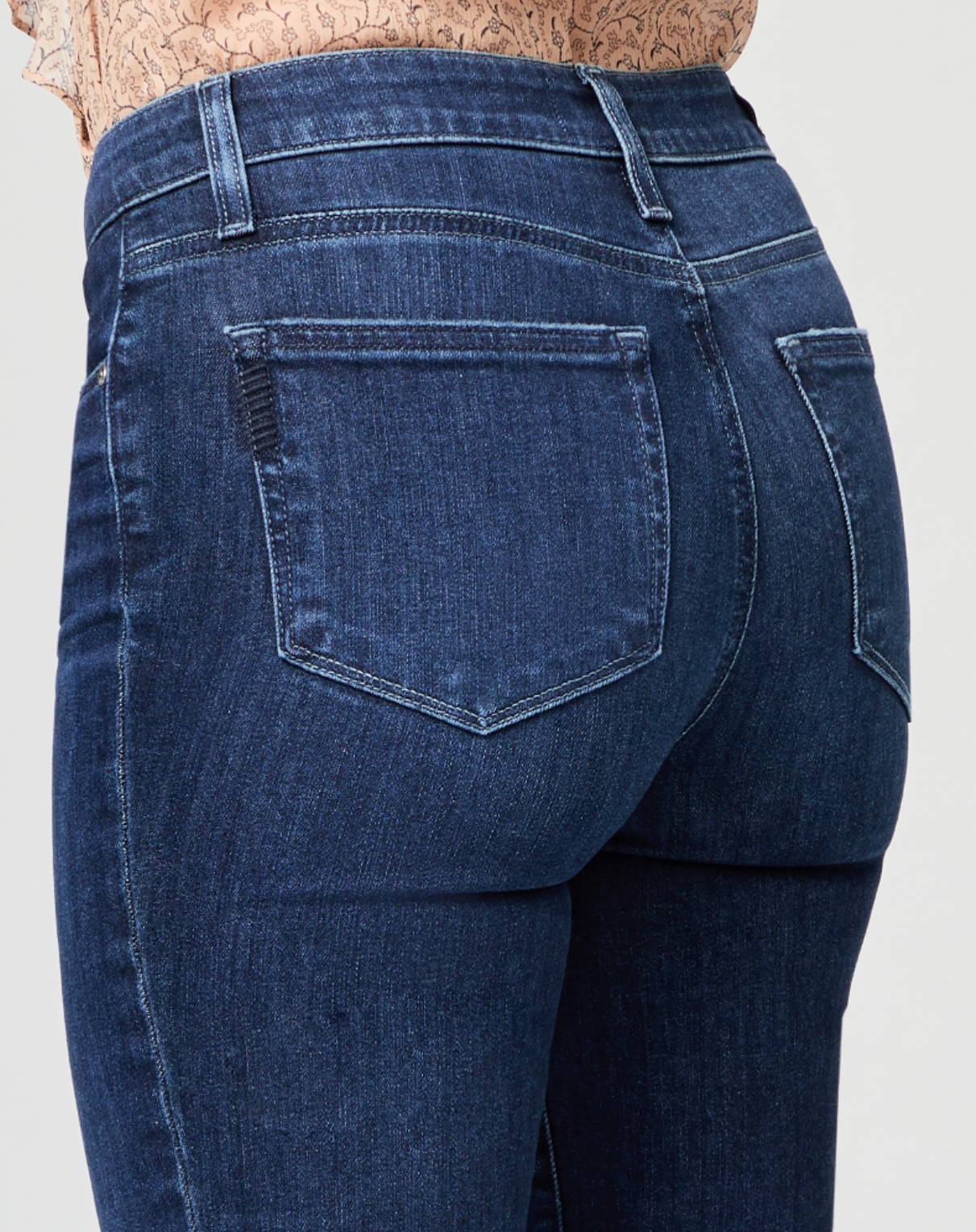 close of view of the rear pocket detail on the hoxton high rise straight jean from paige in monarch blue