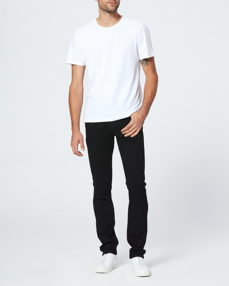 full body view of the lennox skinny fit jean from Paige in black shadow, styled with a white t-shirt